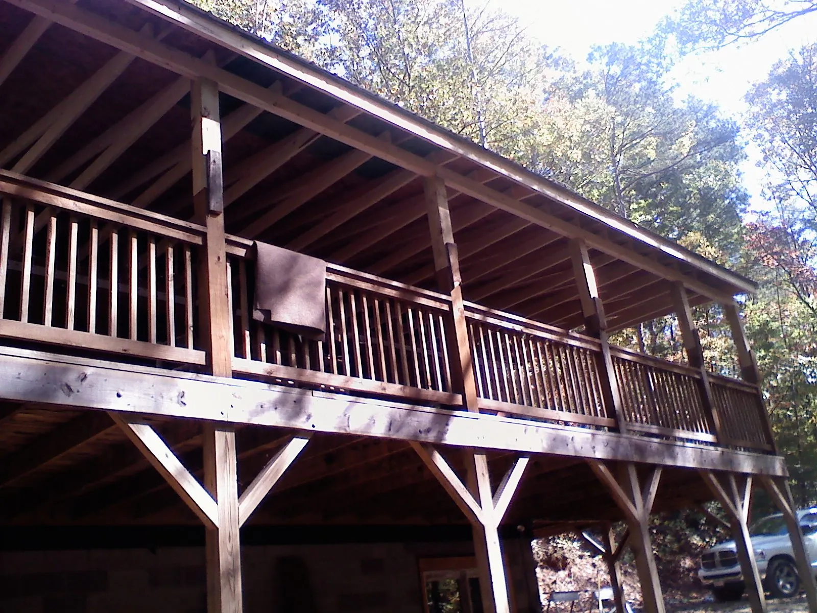 Timber framing under a new elevated porch and deck — Roof Leak Repair in Helmville by Roofing Brothers